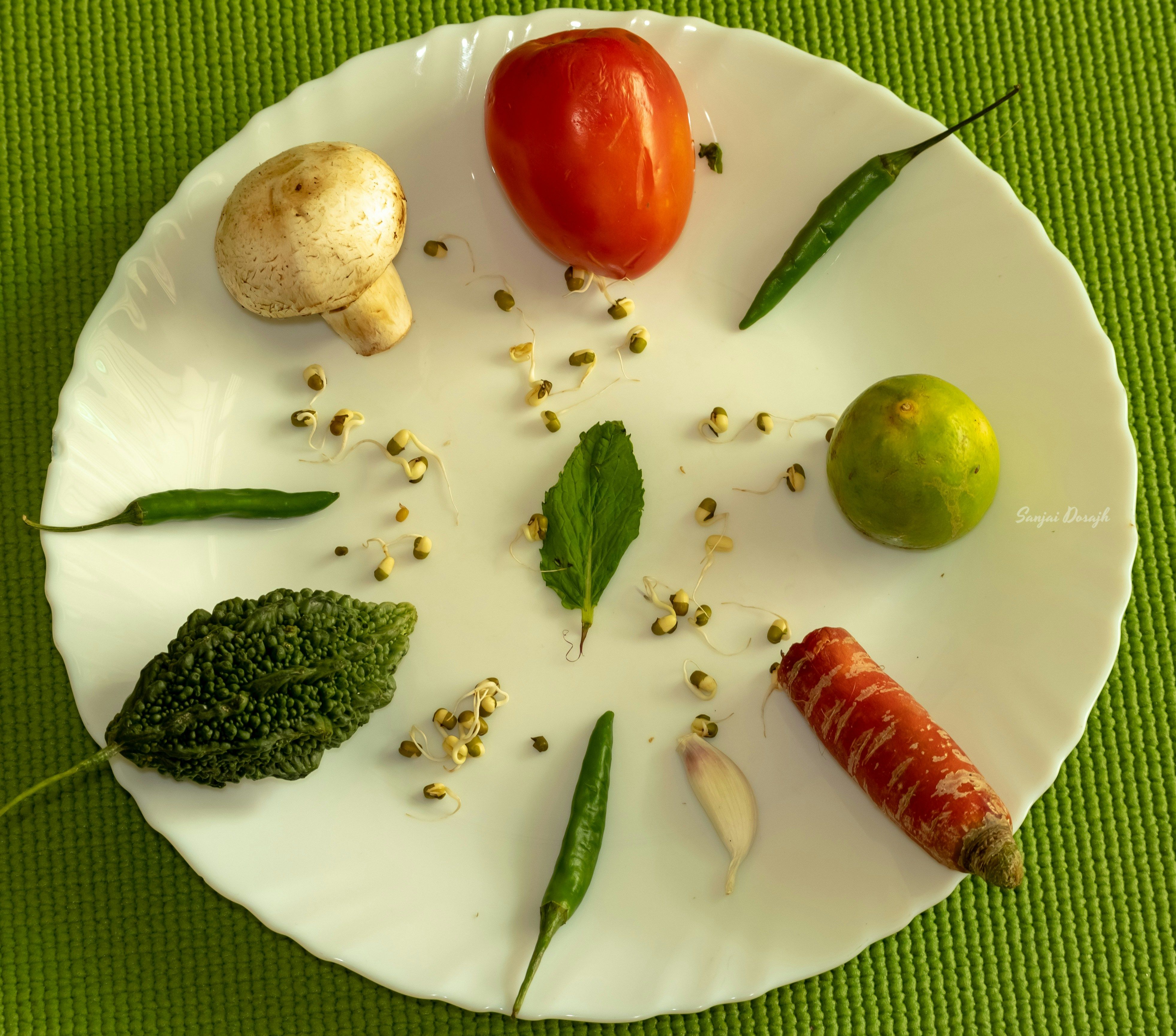 a white plate topped with different types of vegetables