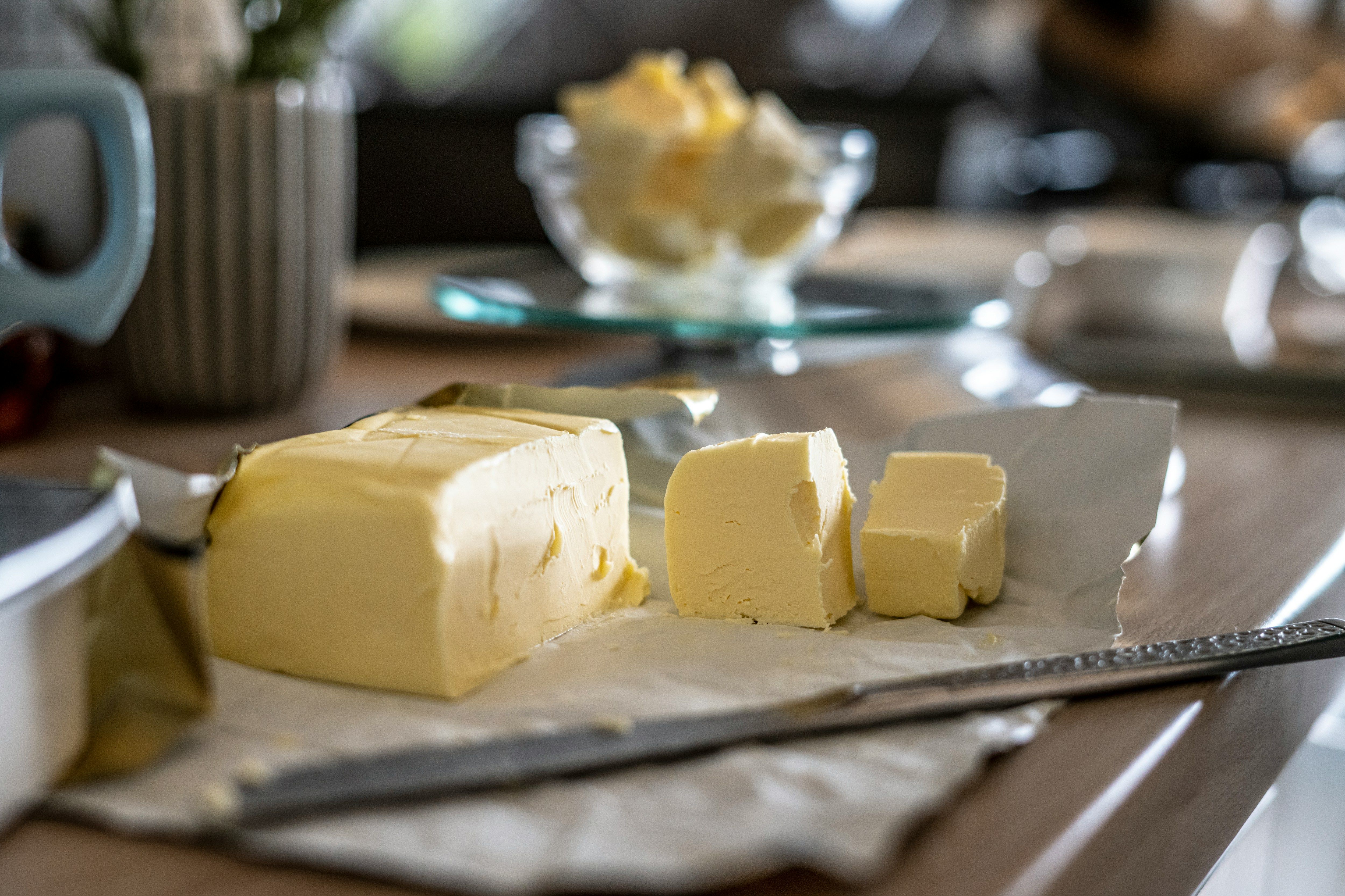 a block of butter sitting on top of a cutting board